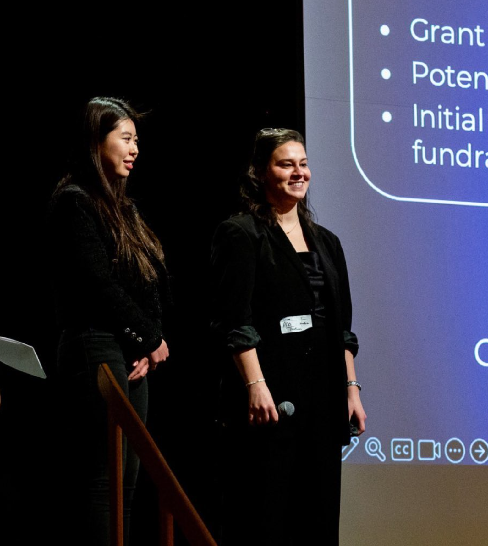 Ana and Lily presenting MinaRosa's mission at an entrepreneurial event